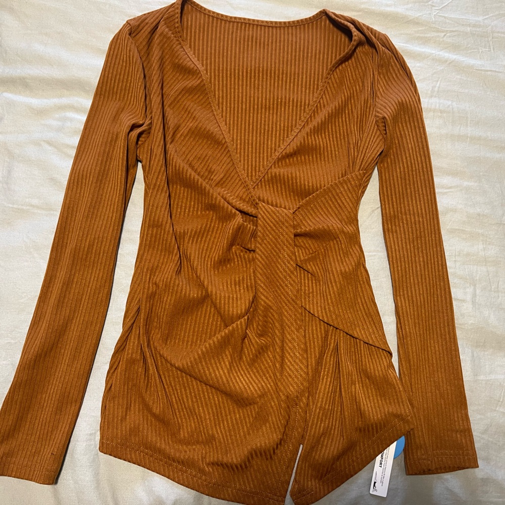 A brand new long sleeve, wrap shirt